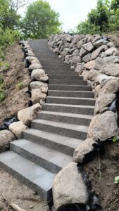 stairs border by boulder wall