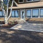 Back of lake home paver patio and flagstone walkway