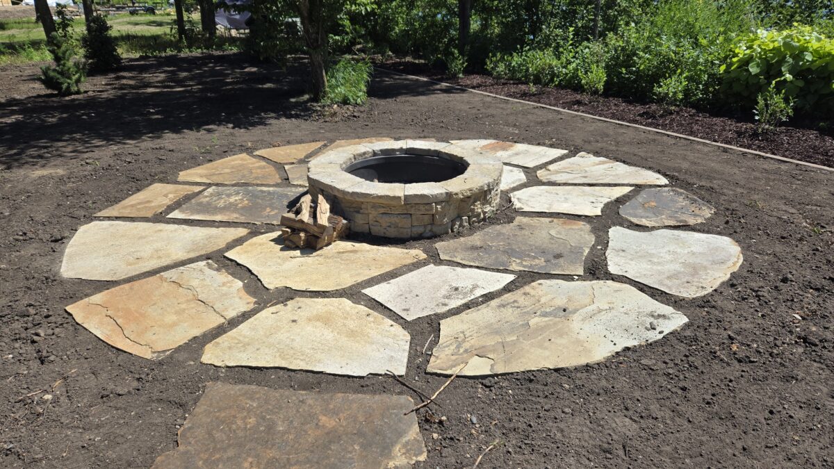 Circular flagstone patio with fire pit