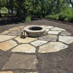 Circular flagstone patio with fire pit
