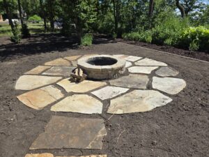 Circular flagstone patio with fire pit