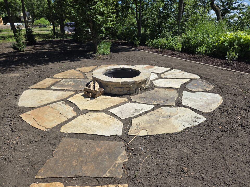 Circular flagstone patio with fire pit