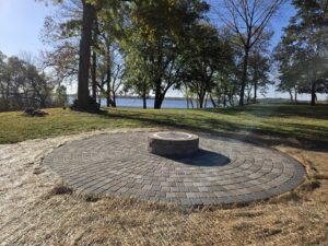 Circular paver patio with raised firepit